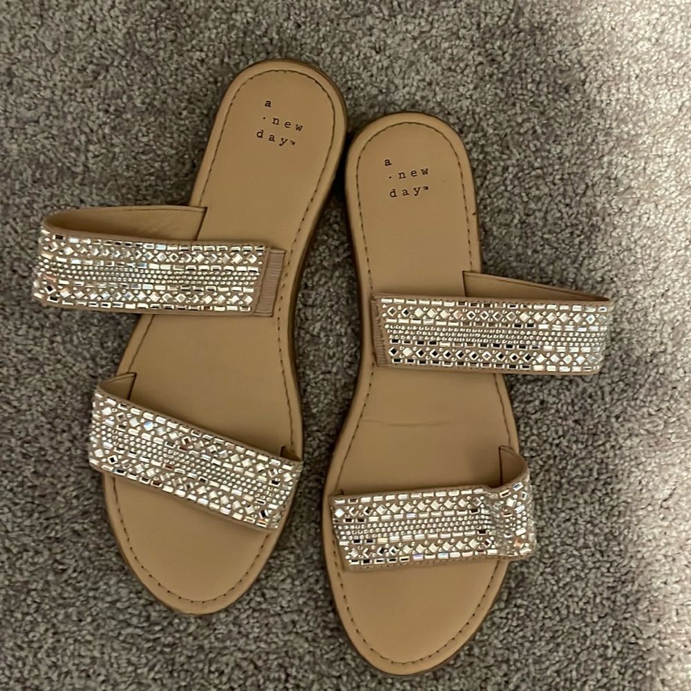 Worn once for a wedding. A new day jeweled flip flops.